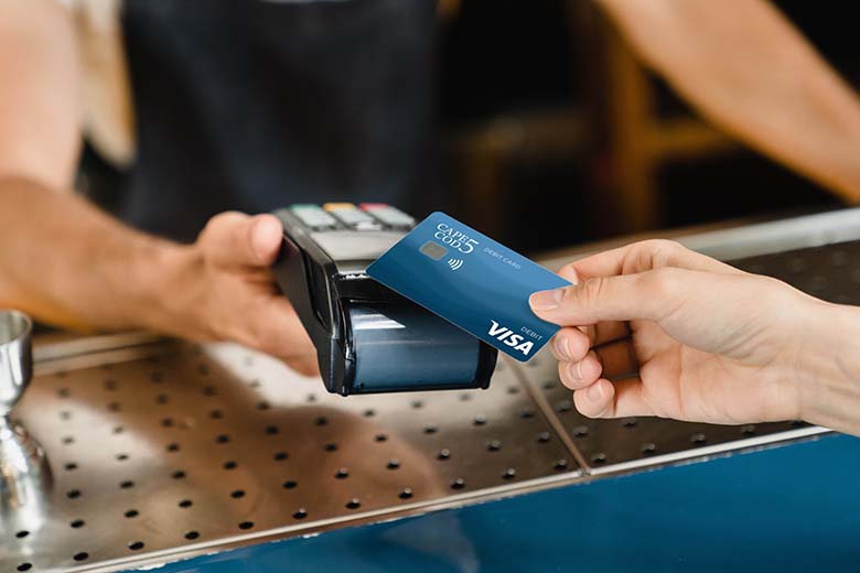 Paying with handheld device using Cape Cod 5 debit card tap to pay