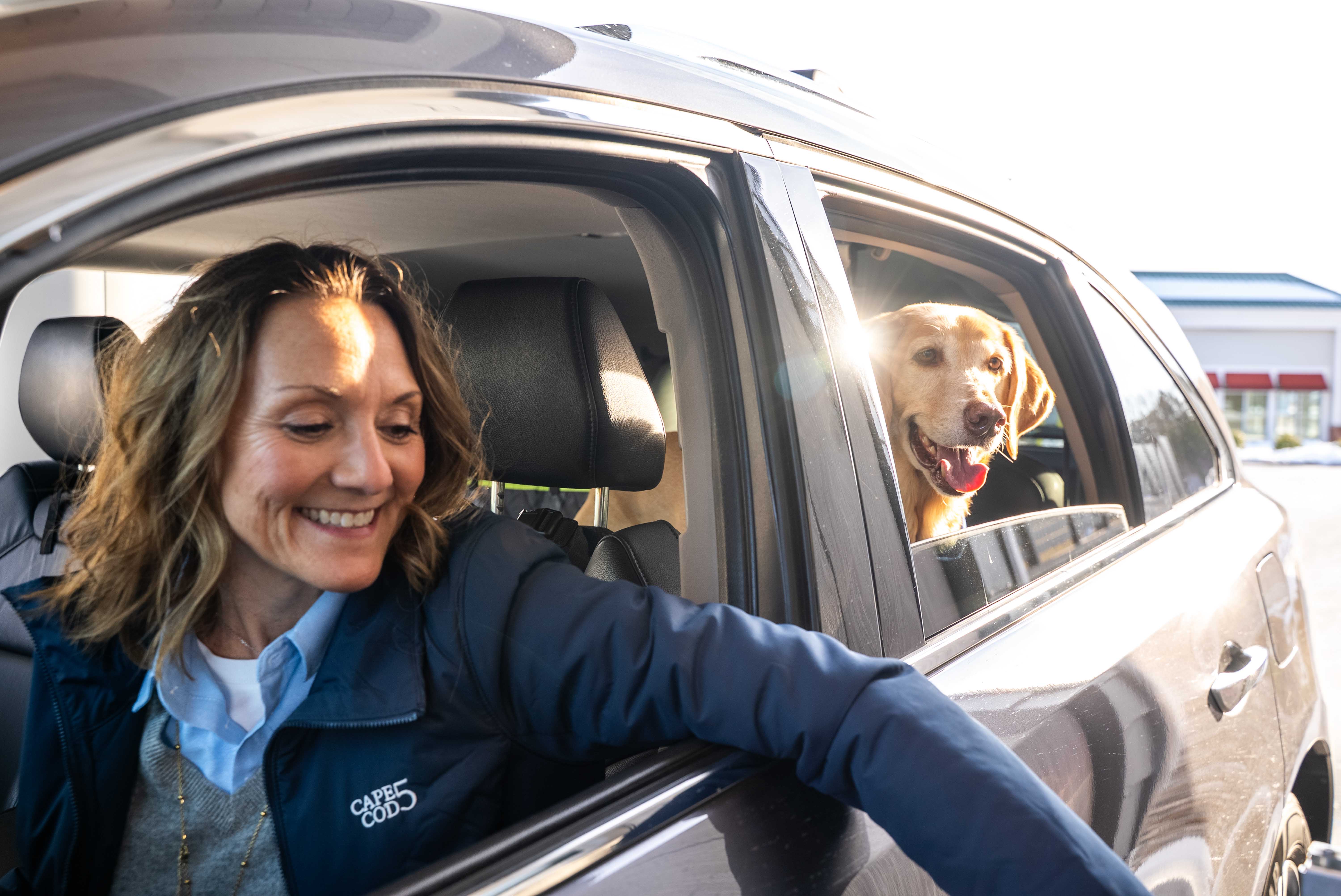 Woman with dog at drive-up