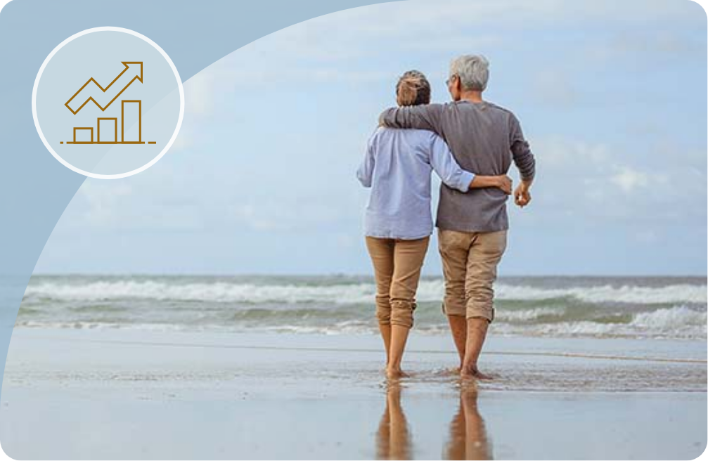 Elderly couple walking together on beach