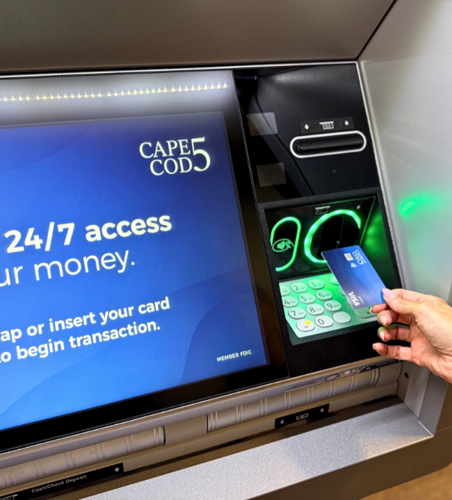 Customer inserting Cape Cod 5 debit card at new ATM