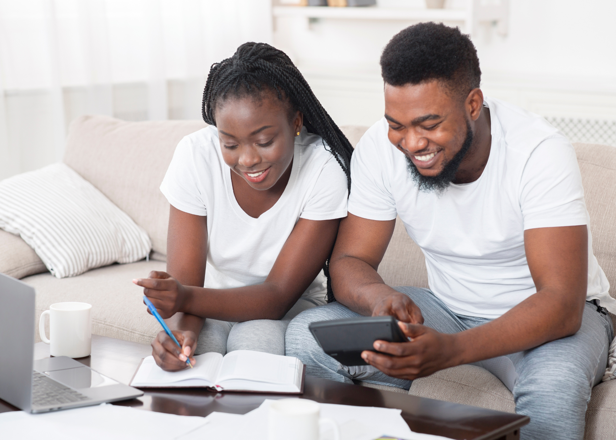 Young black couple planning finances at home