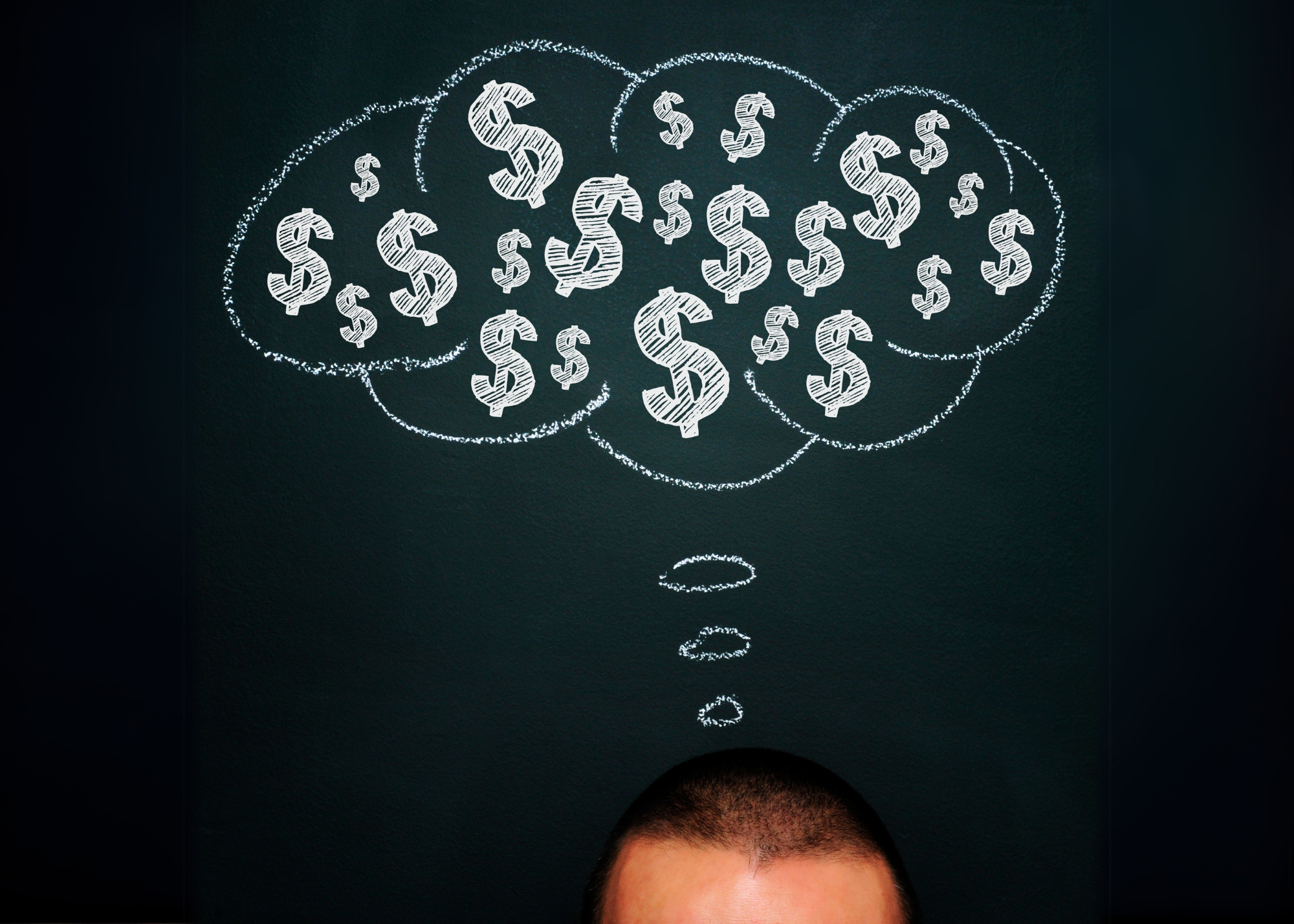 Man with thought bubble with dollar signs
