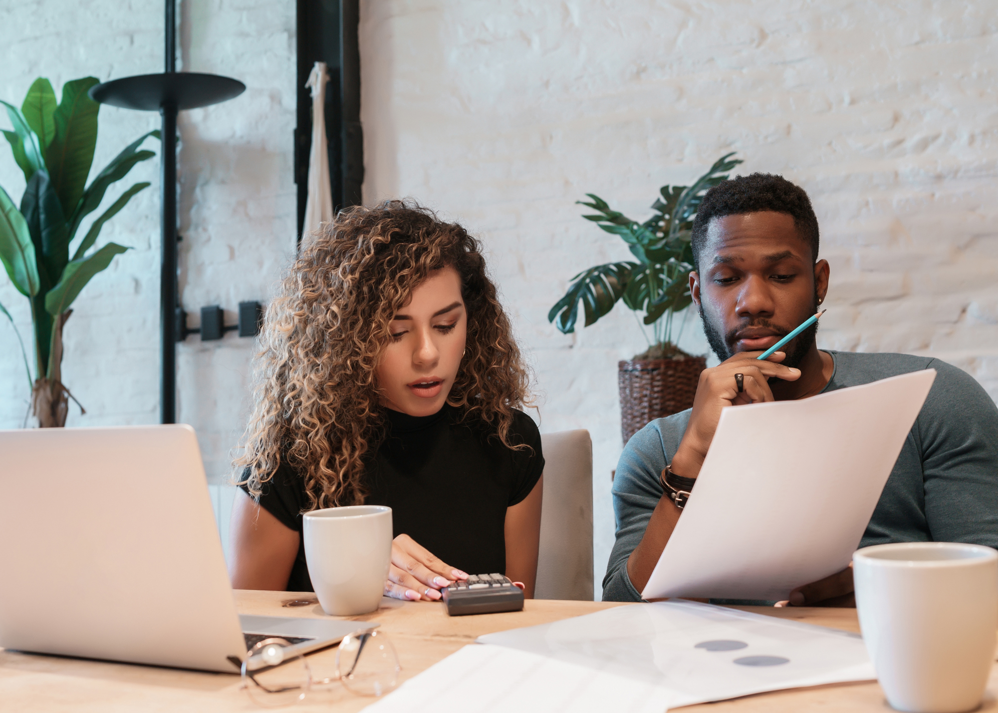 Young african american couple planning monthly budget