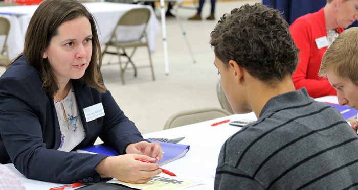 Cape Cod 5 employee helping student at Credit for Life fair