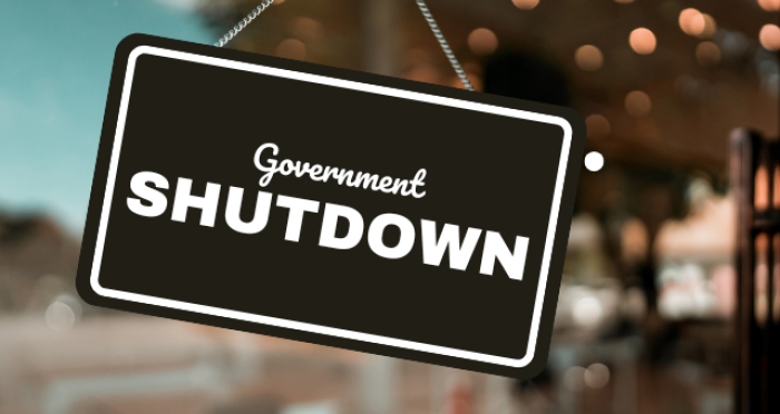 Glass door with shutdown sign