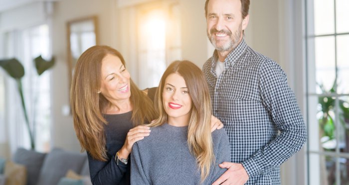 Parents embracing daughter going to college