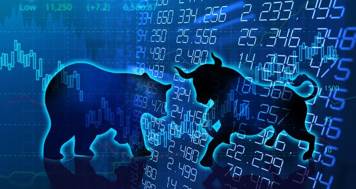 Bear and bull stock market symbols with numbers backdrop