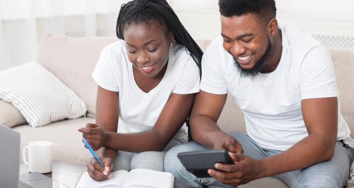 Young black couple planning finances at home