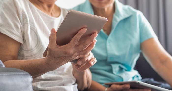 Seniors using tablet and laptop