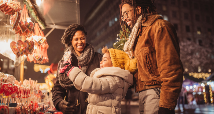 Family holiday shopping at outdoor market