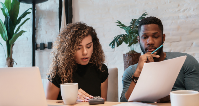 Young african american couple planning monthly budget